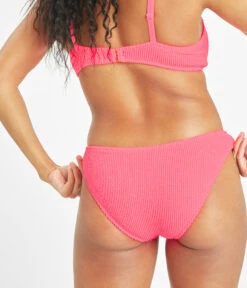 The Swim Ruched Bikini Bottom: Electric Pink -Outlet No Wire Bras Store 3 on model back swim ruched bikini bottom electric pink