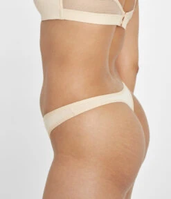 The All-Day Thong 5-Pack: Toasted Almond -Outlet No Wire Bras Store 3 on model side all day thong toasted almond
