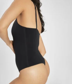 The Sleek Bodysuit: Jet Black -Outlet No Wire Bras Store 3 on model side sleek bodysuit jet black