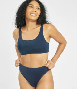 The Swim High Waist Bikini Bottom: Navy -Outlet No Wire Bras Store 4 on model front1 swim high waist bikini bottom navy