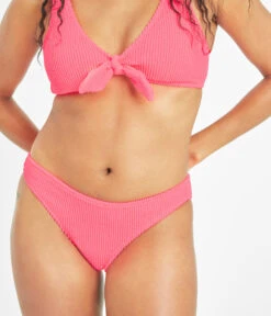 The Ruched Plunge Bralette & Bikini Swim Bundle: Electric Pink -Outlet No Wire Bras Store 6 on model front swim ruched bikini bottom electric pink