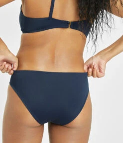 The Bralette & Bikini Swim Bundle: Navy -Outlet No Wire Bras Store 8 on model back swim bikini bottom navy 1b154d1a e682 42a4 bc62 b748641da083